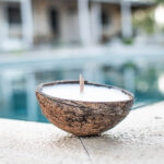 Coconut Shell Candle floats on the water
