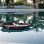 Coconut Shell Candle floats on the water surface